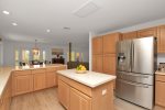 Large kitchen with stainless appliances, island and tons of counter space
